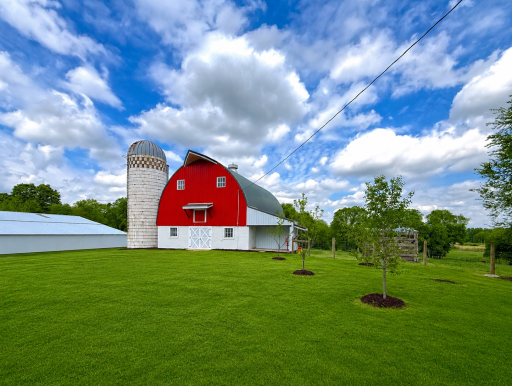 Picture perfect! Expansive barn interior offering a versatile and functional layout with ample open space for a variety of uses.