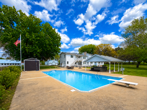Outside, the property truly shines with a 24x44 swimming pool and hot tub, perfect for relaxing while taking in the sweeping countryside views.