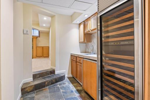 Bar area off lewer level family room with wine cooler
