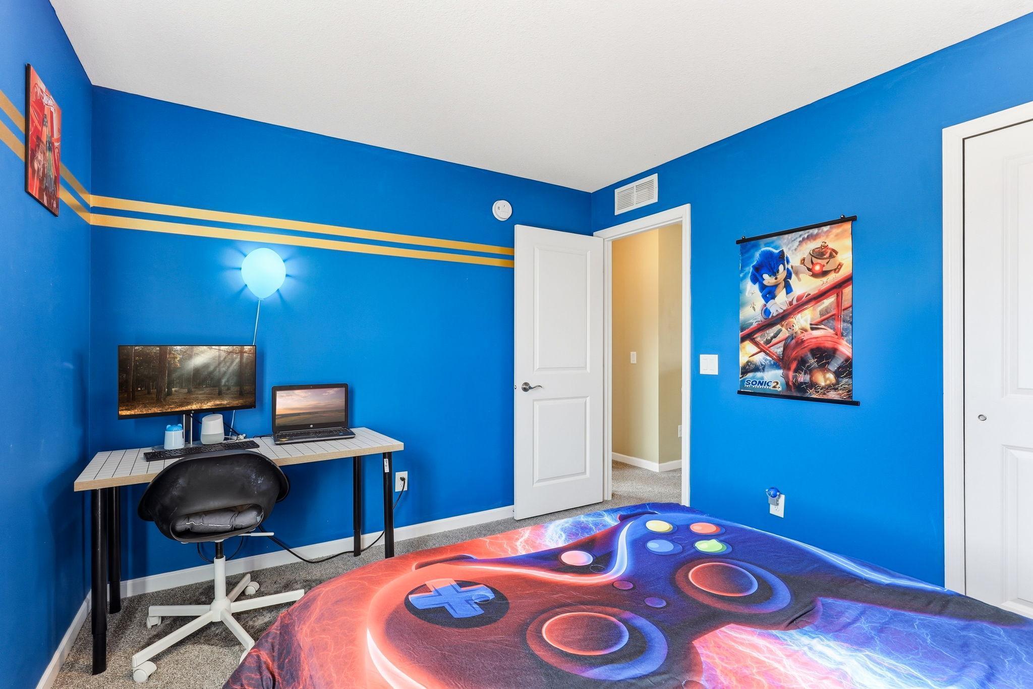 The second angle of this upper-level bedroom reveals desk space. Giving the room both layout flexibility and personalization.