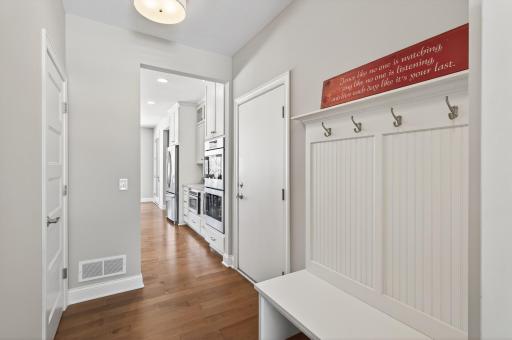 The main level also features a spacious mudroom with a convenient half bath.