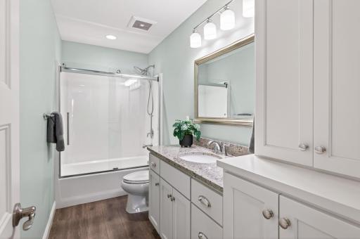 The lower level full bathroom ensures convenience and privacy for guests.