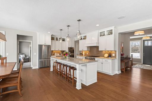 Inside, the light-filled open-concept main level is designed to feel both spacious and inviting, with intentional craftsmanship and elevated finishes throughout.