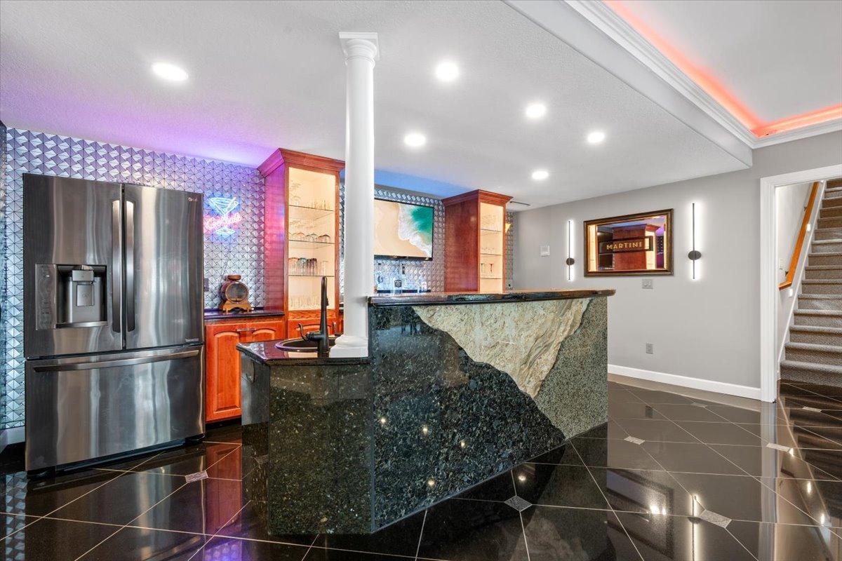 Custom Wet Bar, 15' custom backbar cabinetry with 2 lighted display towers