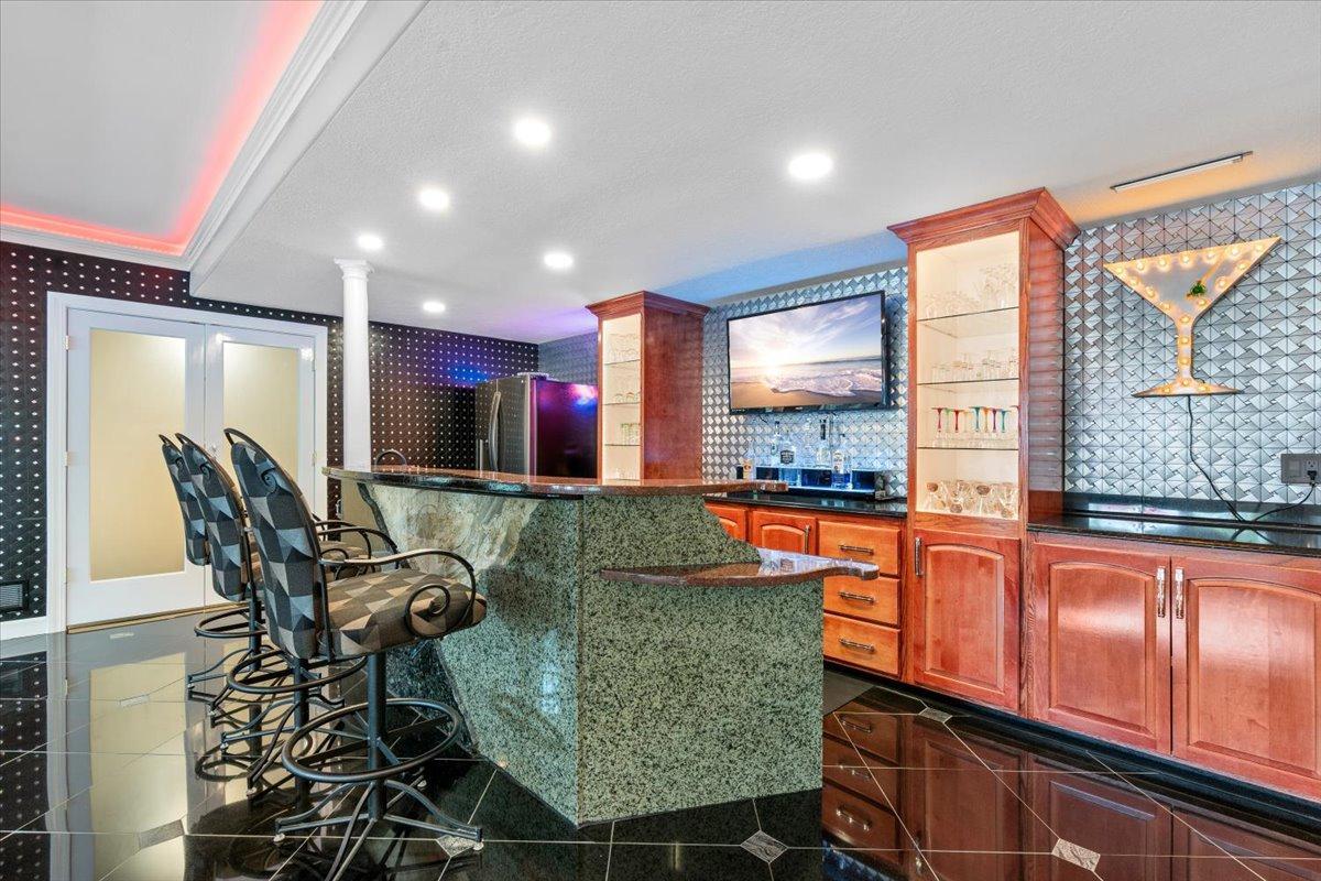 Custom Wet Bar, 15' custom backbar cabinetry with 2 lighted display towers