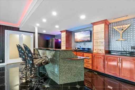 Custom Wet Bar, 15' custom backbar cabinetry with 2 lighted display towers