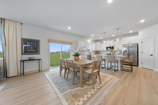 (Photo of a decorated model, actual finishes will vary.) Situated steps away from the kitchen, residents can effortlessly serve piping-hot meals straight off the stove and onto the dining table with ease.