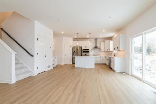 (Photo of a decorated model, actual finishes will vary.) Situated steps away from the kitchen, residents can effortlessly serve piping-hot meals straight off the stove and onto the dining table with ease.