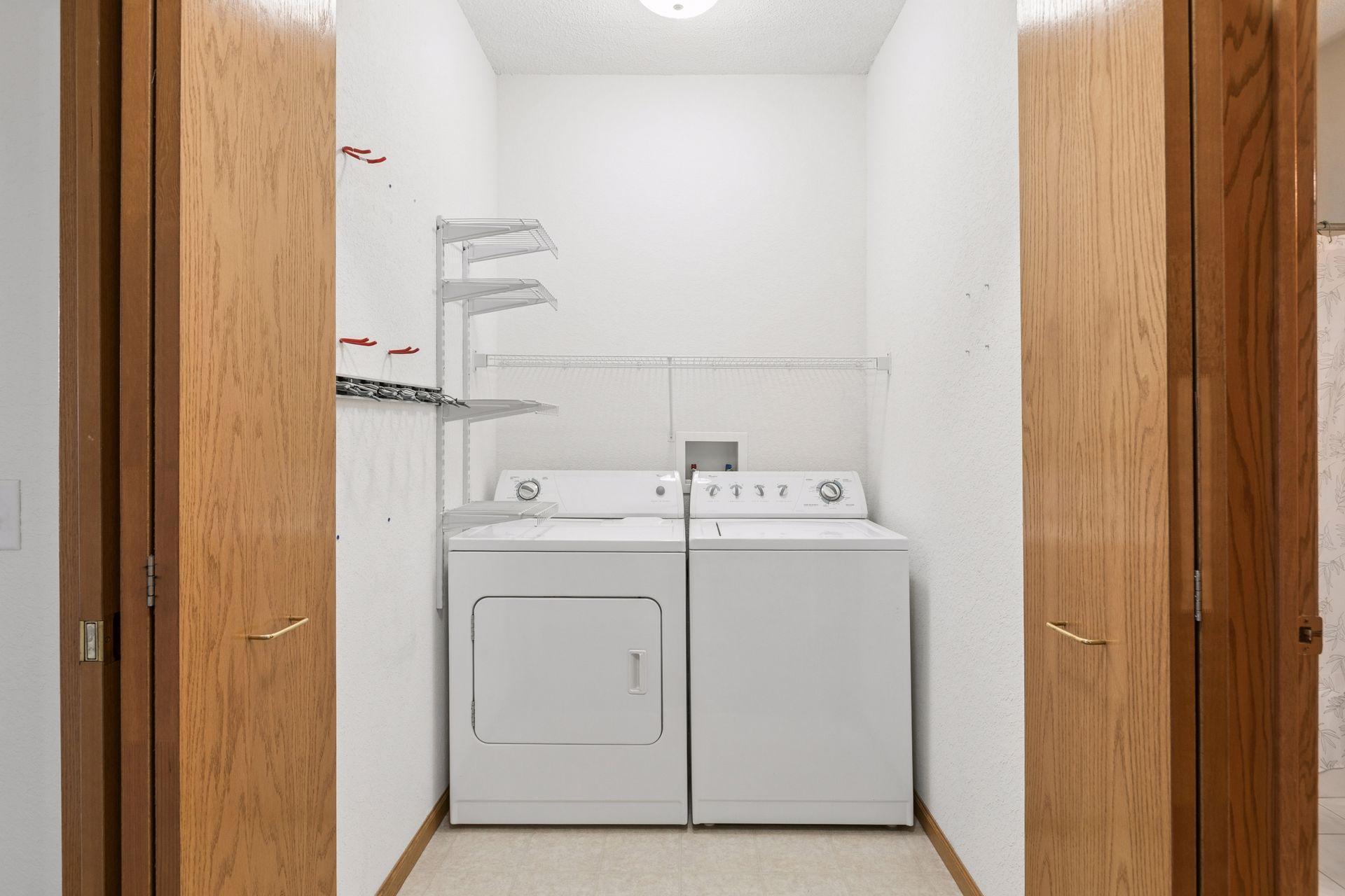 Nice size, in unit laundry room with shelving