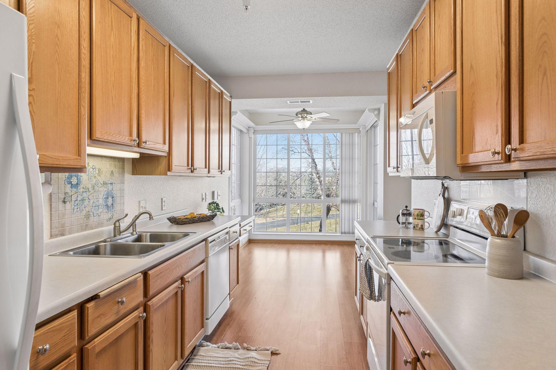 Kitchen and informal dining area surrounded with windows