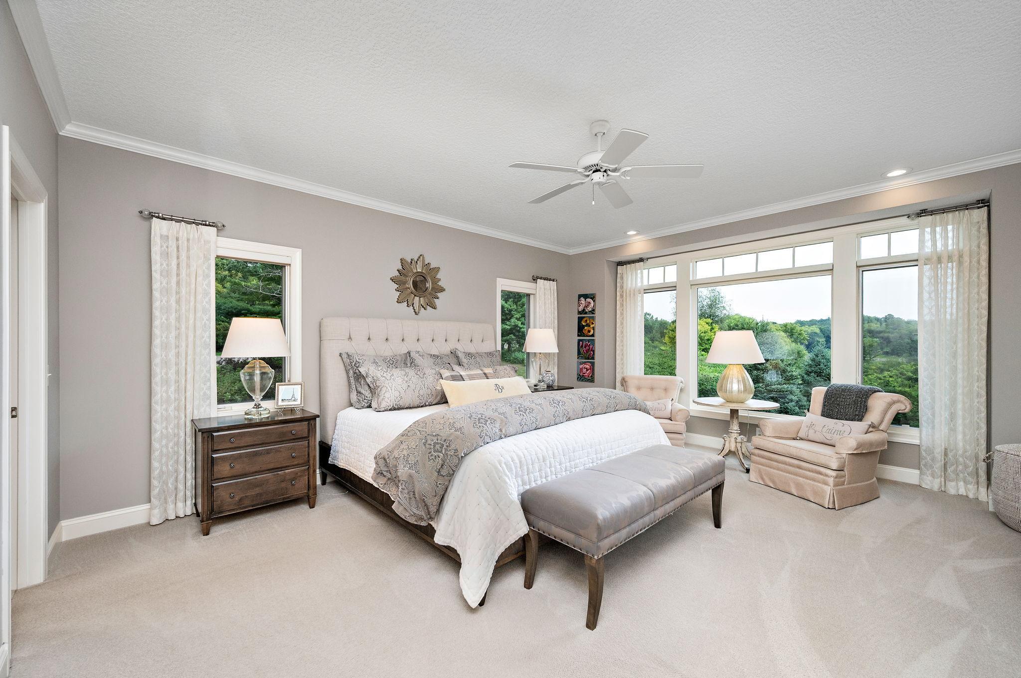 The main level primary suite is sure to impress