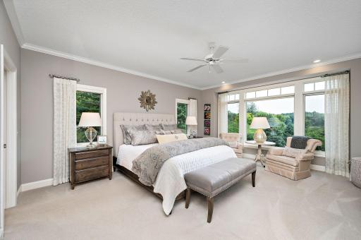 The main level primary suite is sure to impress
