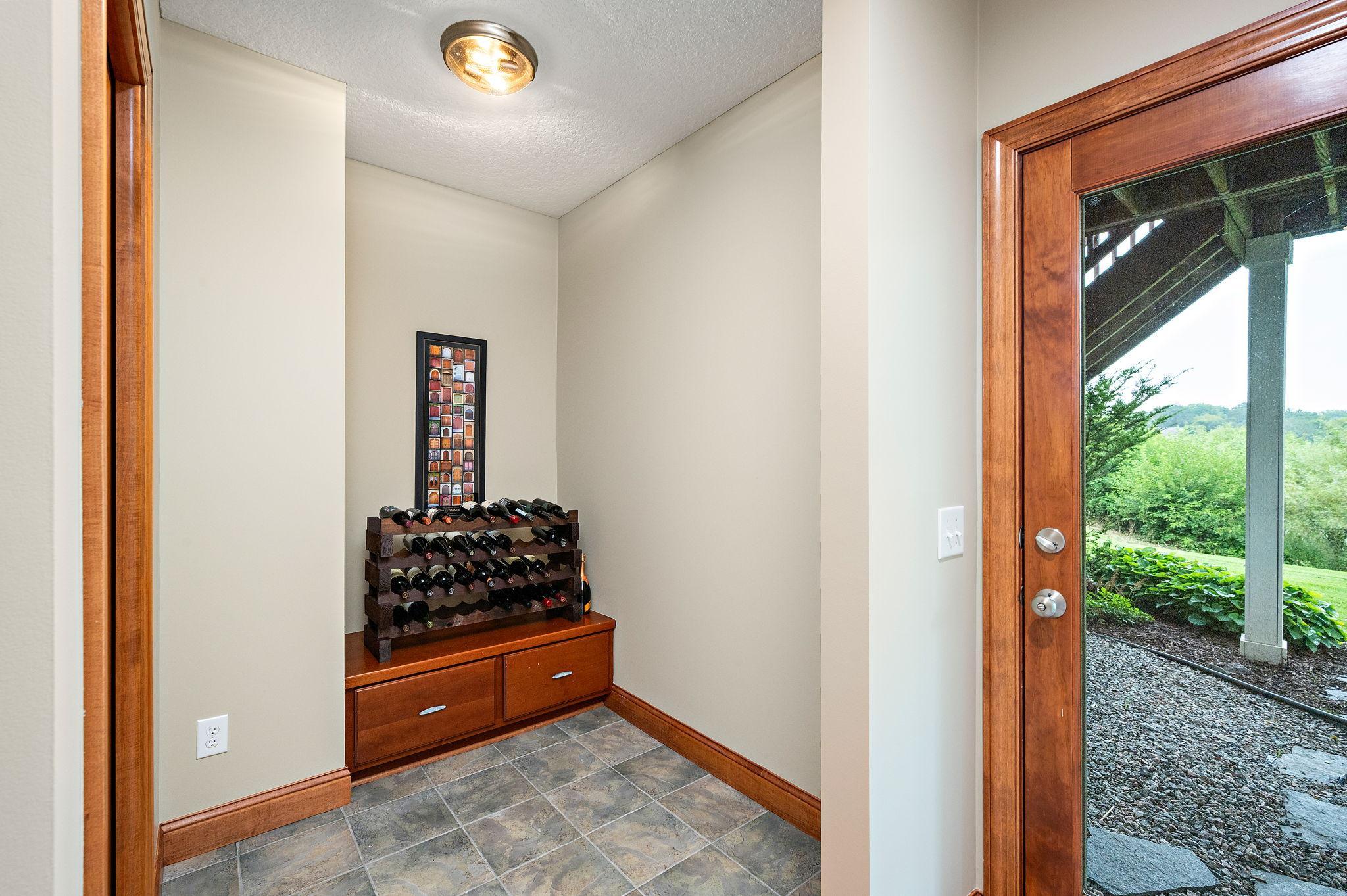 Lower-level mudroom, convenient door to the back exterior.
