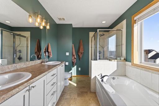 Relaxing Owners Bath complete with double sinks, jetted tub and separate shower.