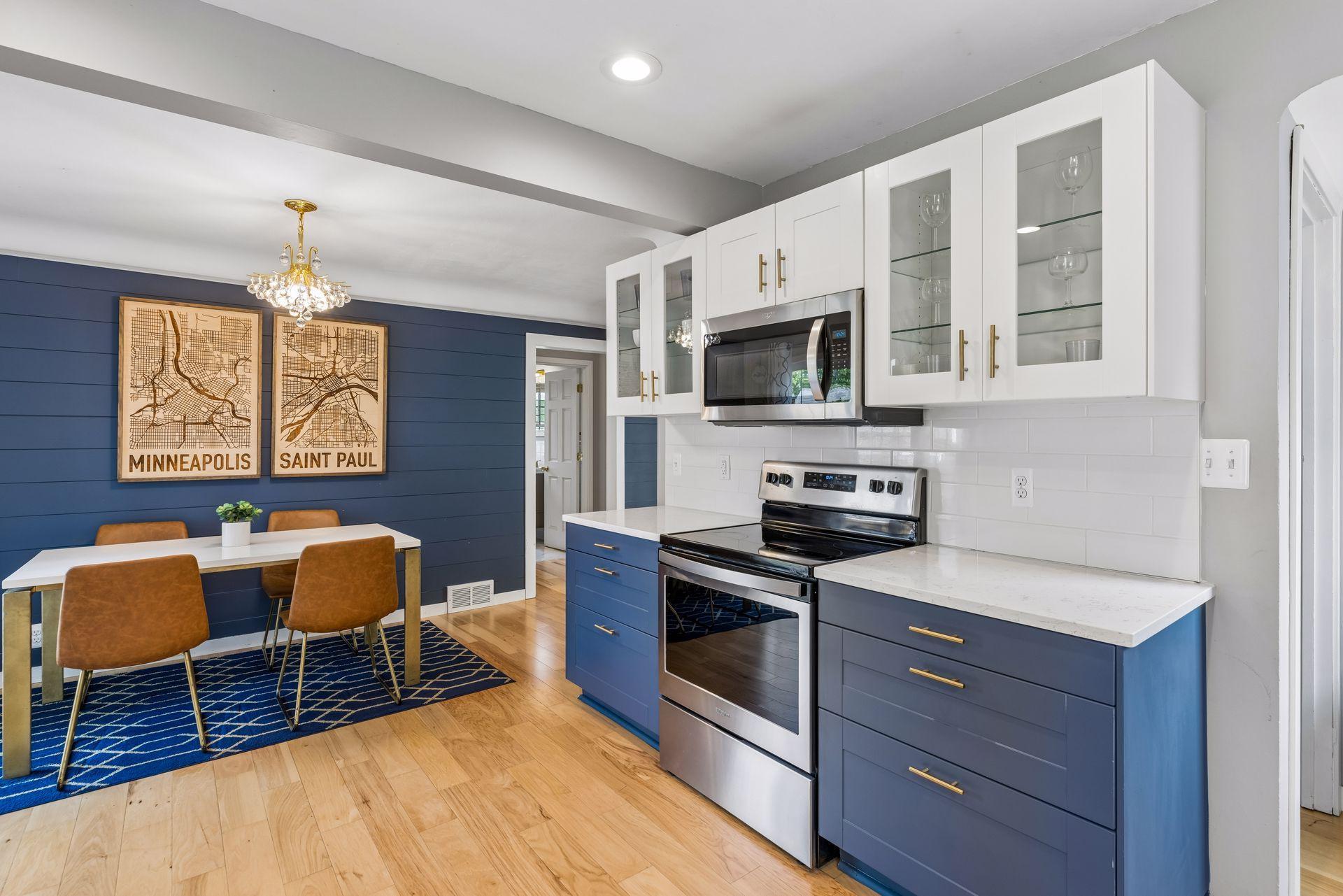 Stainless steel appliances include microwave, oven, refrigerator, and dishwasher.