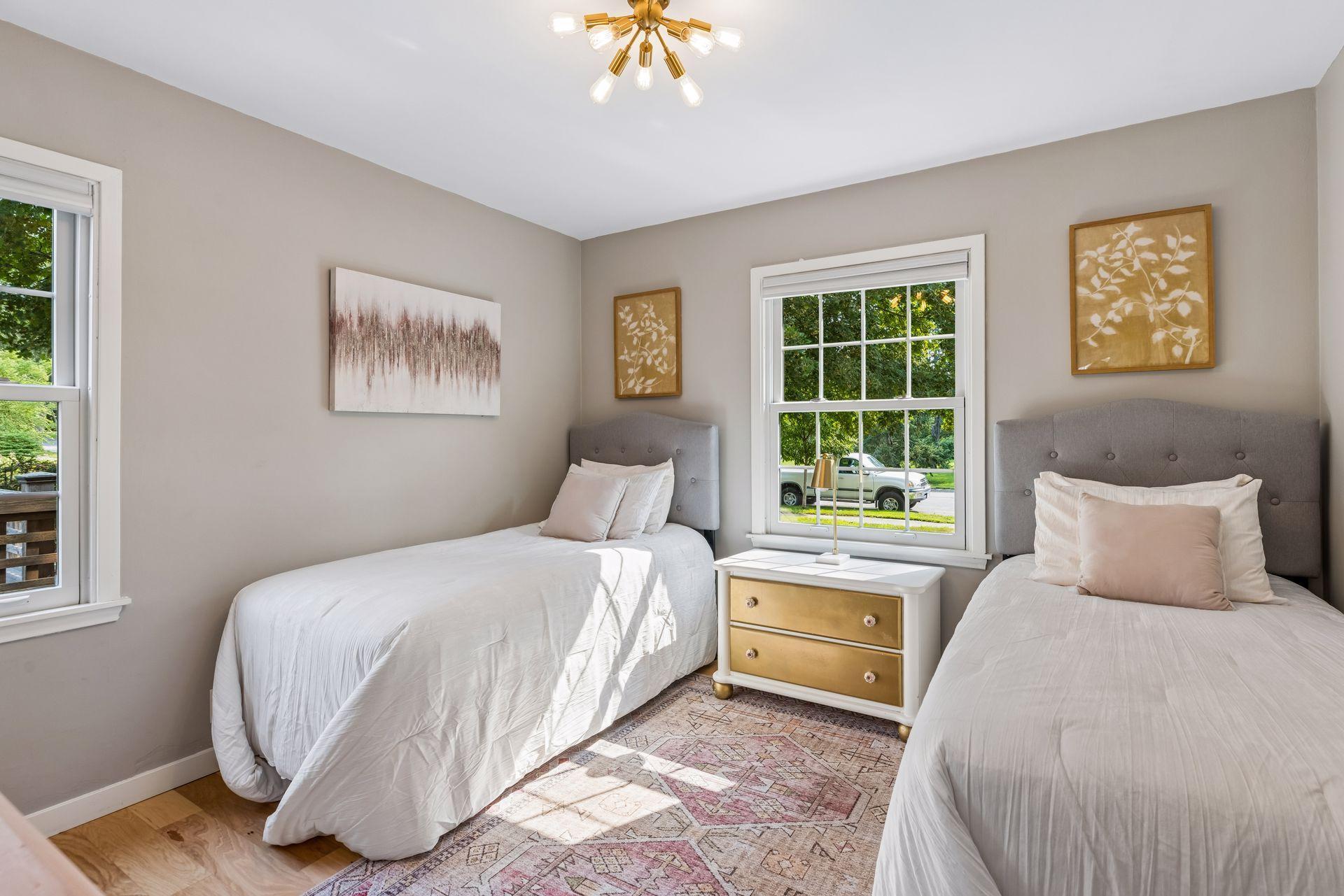Two bedrooms on the main level, with stylish lighting.