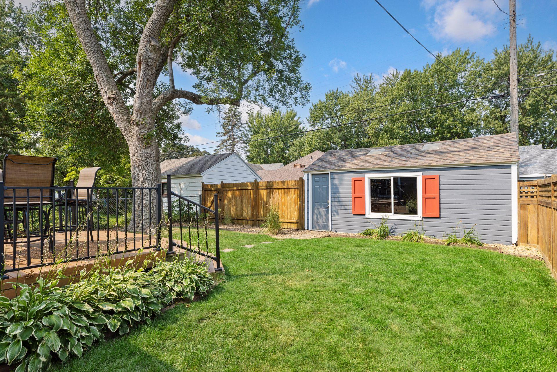 Fully-fenced flat backyard, great for hosting friends and family. NOT TO BE MISSED! Interior photo of finished garage coming soon- currently set up as a game room.