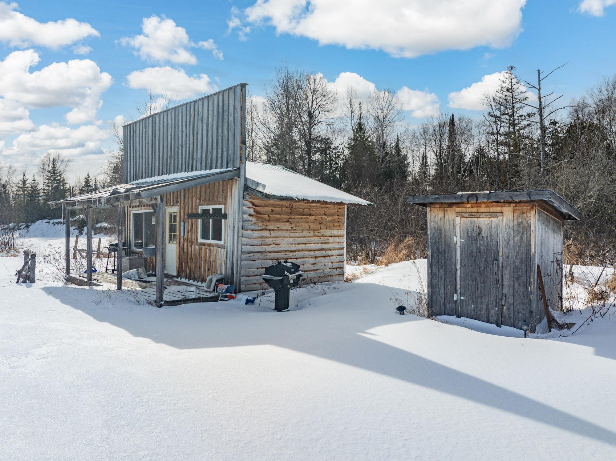 Bunkhouse and outhouse