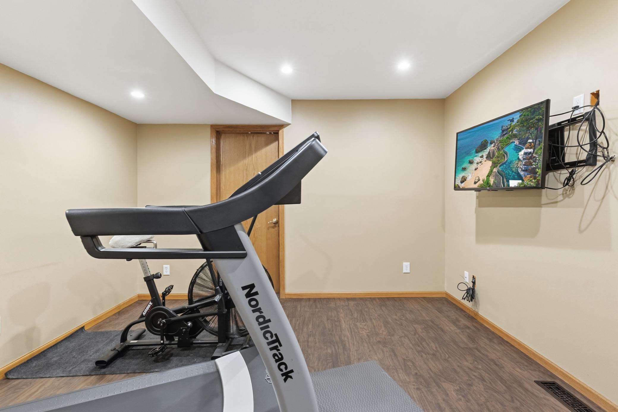 An exercise room/game room/bonus room in the lower level. Then closed door seen in the picture leads to the storage room.
