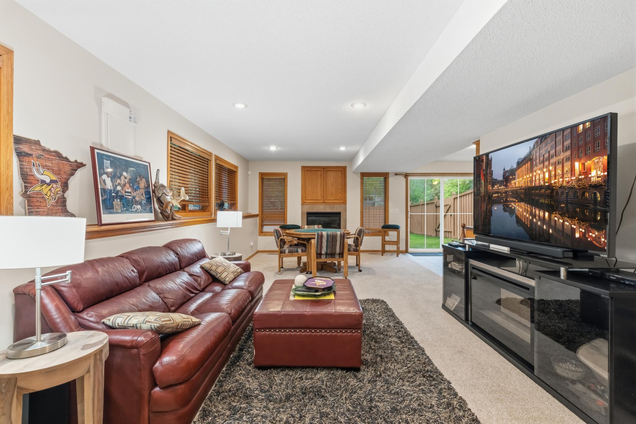 The family room in the walkout basement. It has a second gas fireplace.