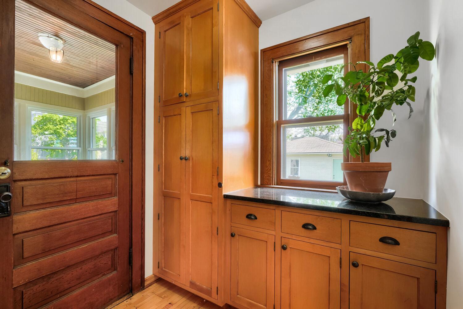 The mudroom built-ins designed from the same builder as the kitchen