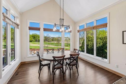 Informal dining has great views of backyard and course
