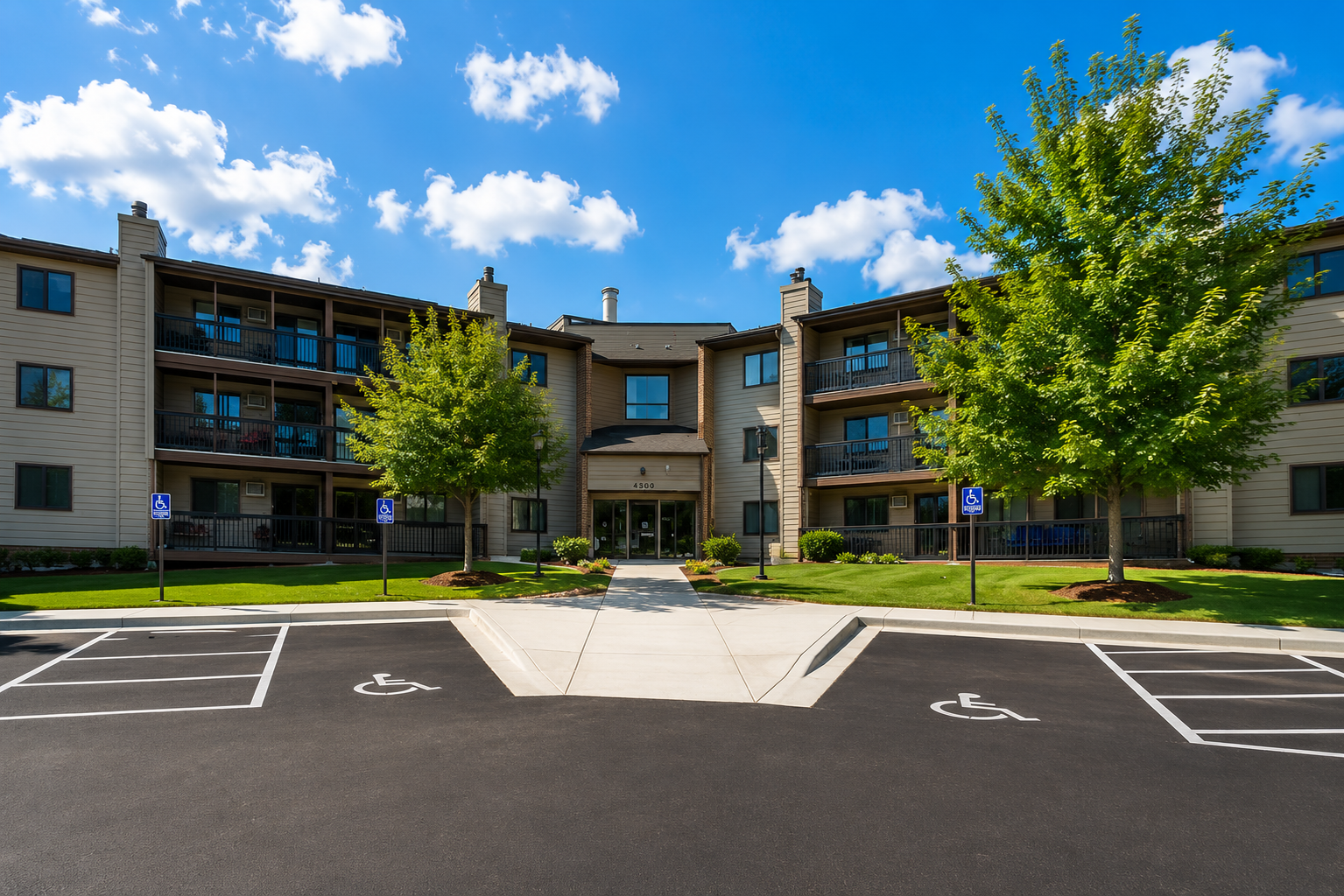 An alternate exterior view showcases the clean lines of the building, meticulous landscaping, and excellent accessibility with clear walkways and designated parking areas.
