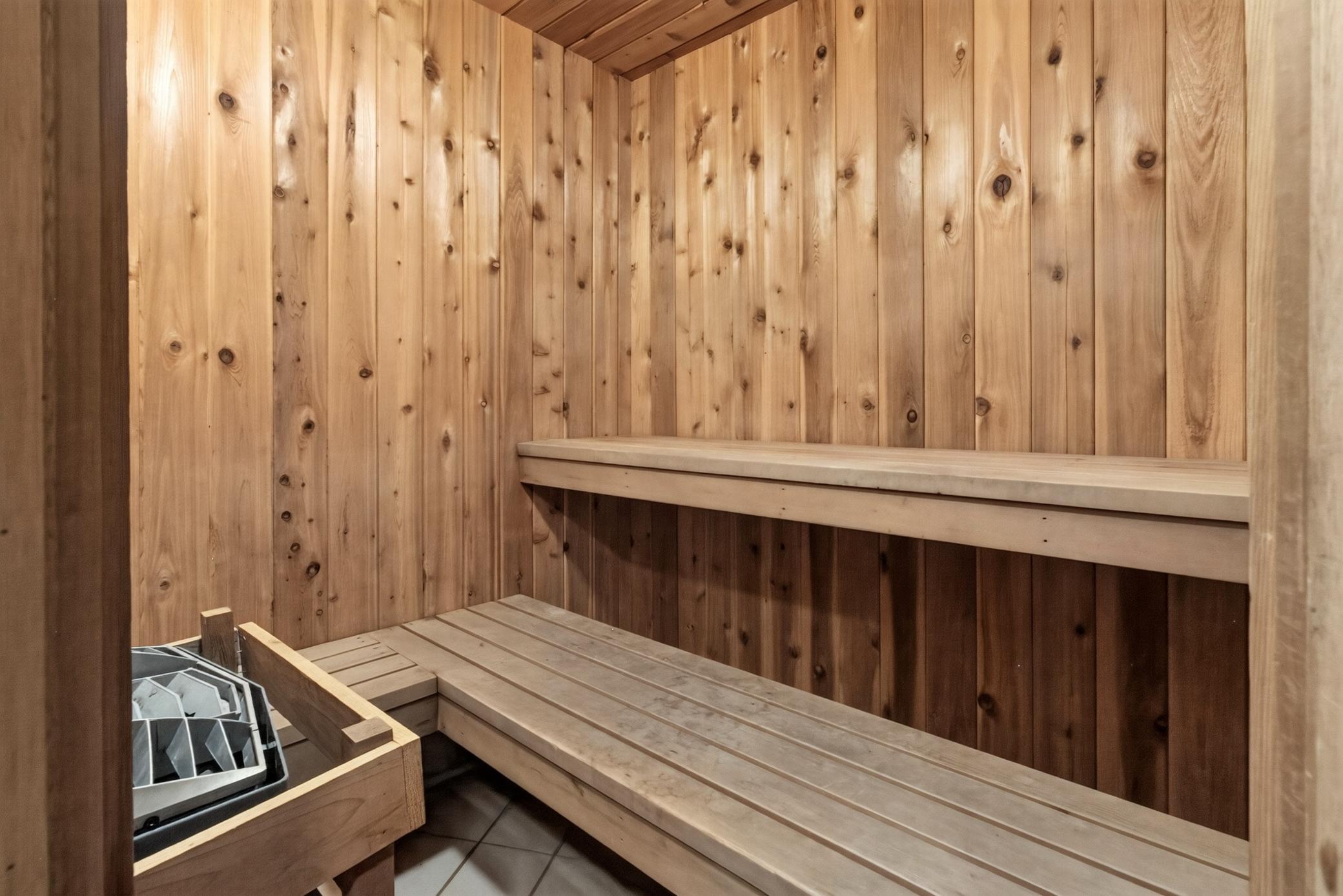 Relax and unwind in the community's private, wood-lined sauna room—a luxurious amenity just steps from your front door