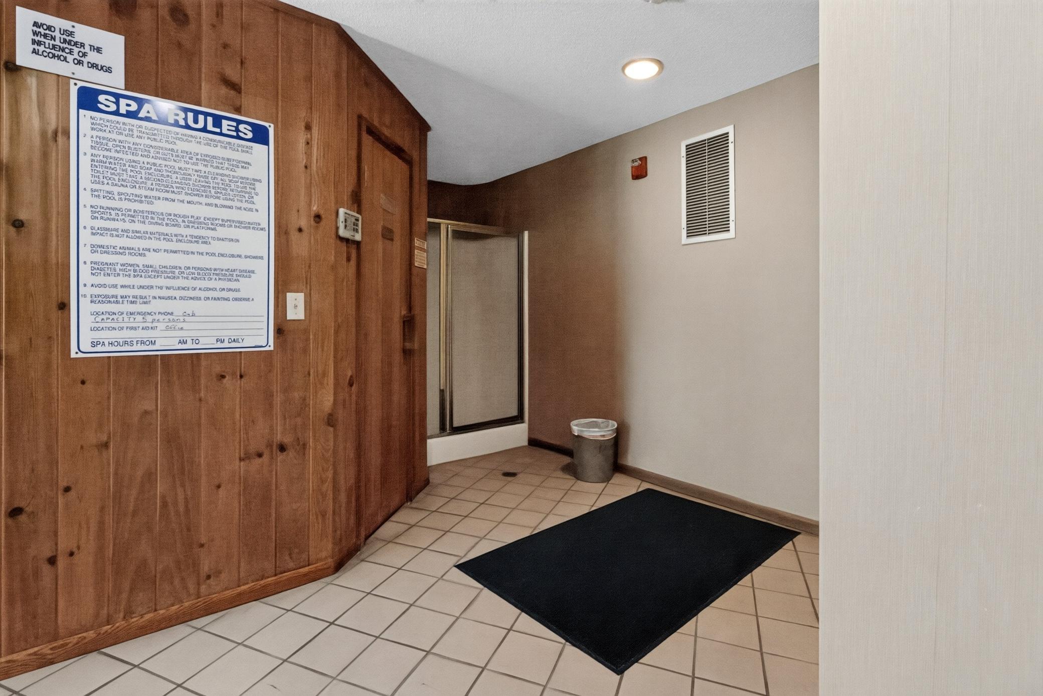 Enjoy access to excellent community amenities, including a dedicated spa and relaxation room clad in beautiful natural wood paneling.