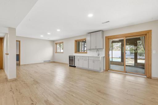 Walkout to your three-season porch area under the deck - easy backyard access.