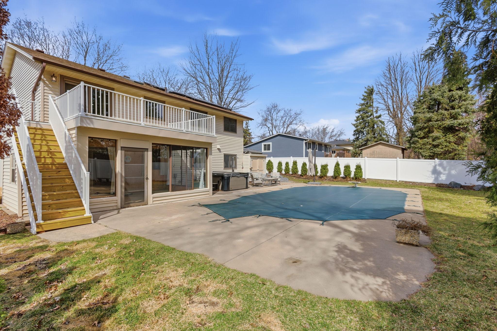 Fully fenced backyard with in-ground pool!