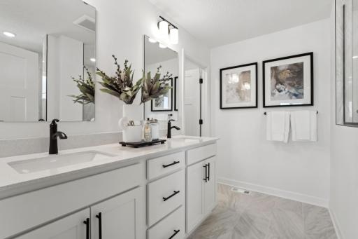 (Photo of model home, finishes will vary) .Dual sinks promote a streamlined morning routine