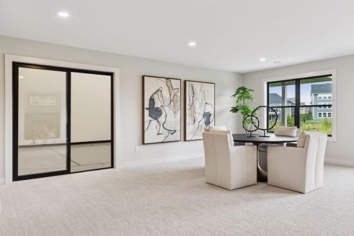 Finished lower level, gas fireplace, wet bar, athletic court