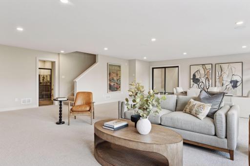 Finished lower level, gas fireplace, wet bar, athletic court