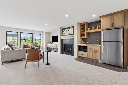 Finished lower level, gas fireplace, wet bar, athletic court