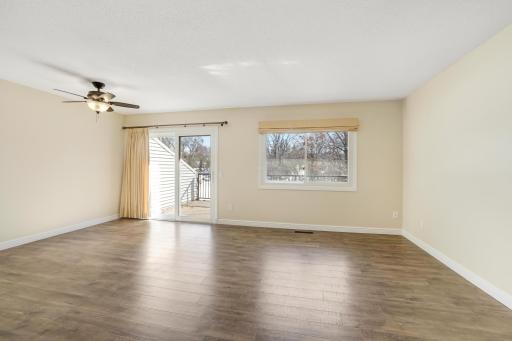 Living room and Dining room with patio door to deck