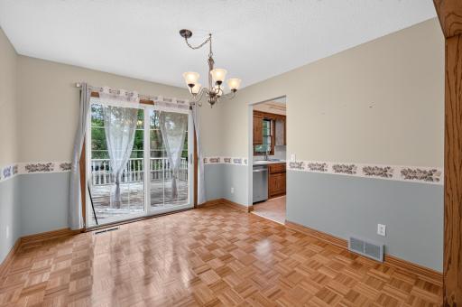 The dining area opens directly to the private deck for convenient outdoor dining.