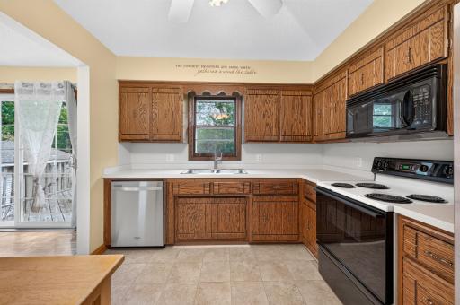 A window above the kitchen sink brings in natural light while offering backyard views.
