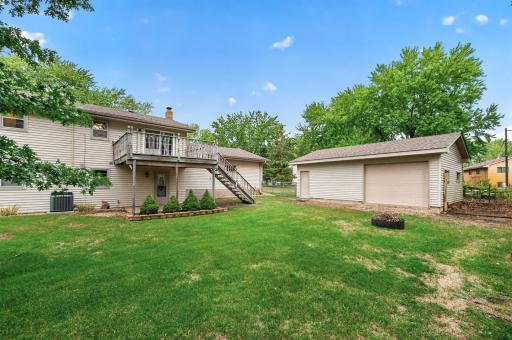 The private backyard brings together the deck, fire pit and detached garage for outdoor enjoyment and added functionality.