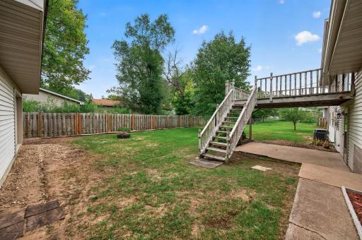 The fully fenced backyard gives children and pets room to play, while the fire pit creates a cozy gathering place.