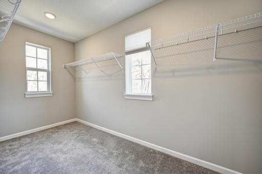 Primary Bedroom Walk In Closet WITH WINDOWS.jpg