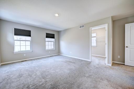 Primary Bedroom with View of Walk In Closet - Upper Level.jpg