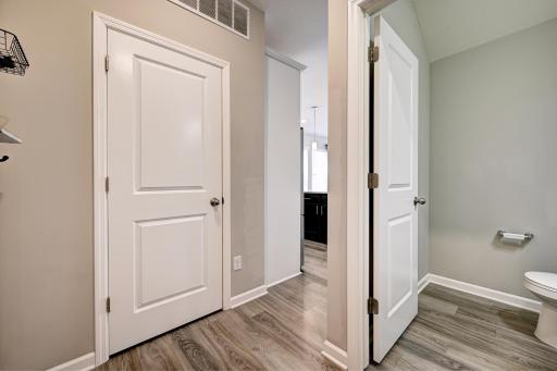 This is the Area behind the Kitchen. Garage Door is on Left. Half Bath - Main Level.jpg