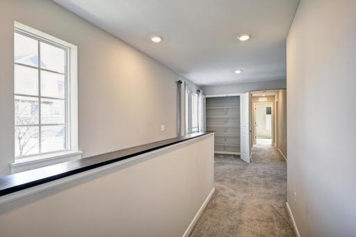 View of Loft from Primary Bedroom. Staircase to the Left.jpg