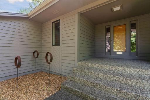 A covered front entry provides a welcoming transition into the home.