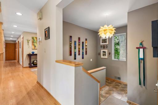 Hardwood floors lead to the lower level, thoughtfully remodeled for added living space.