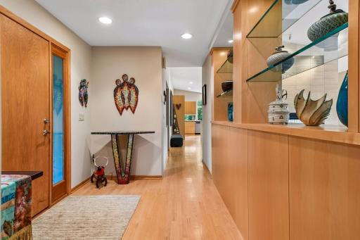 Red oak hardwood floors and custom built-ins welcome you inside.