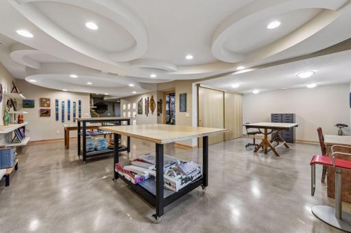 Sculptural ceiling details and built-in shelving bring character to the lower-level living space.
