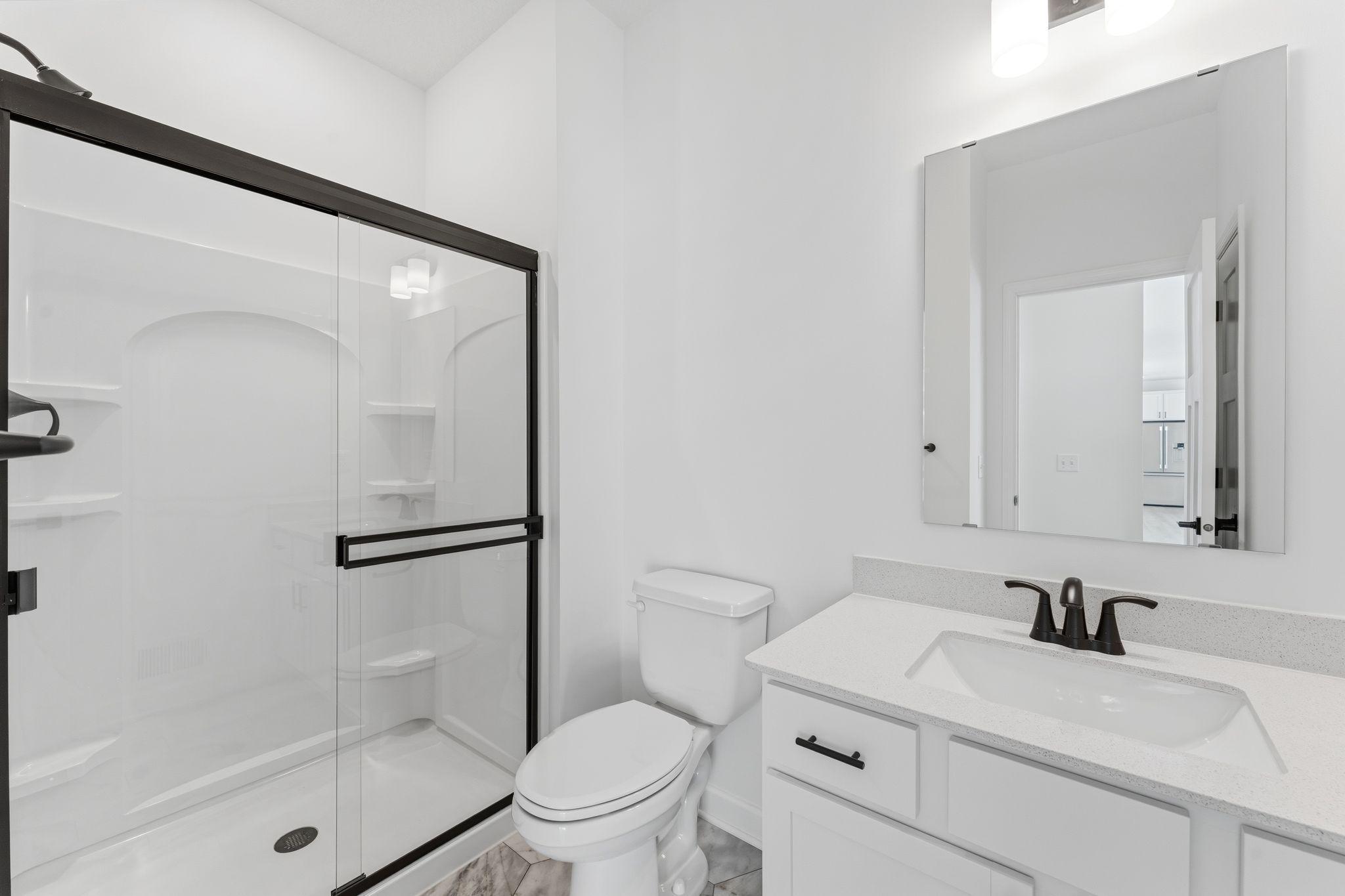 This 3/4 bathroom is located on the the main floor, right next to the first level bedroom, making it more convenient to accommodate guests and family members.