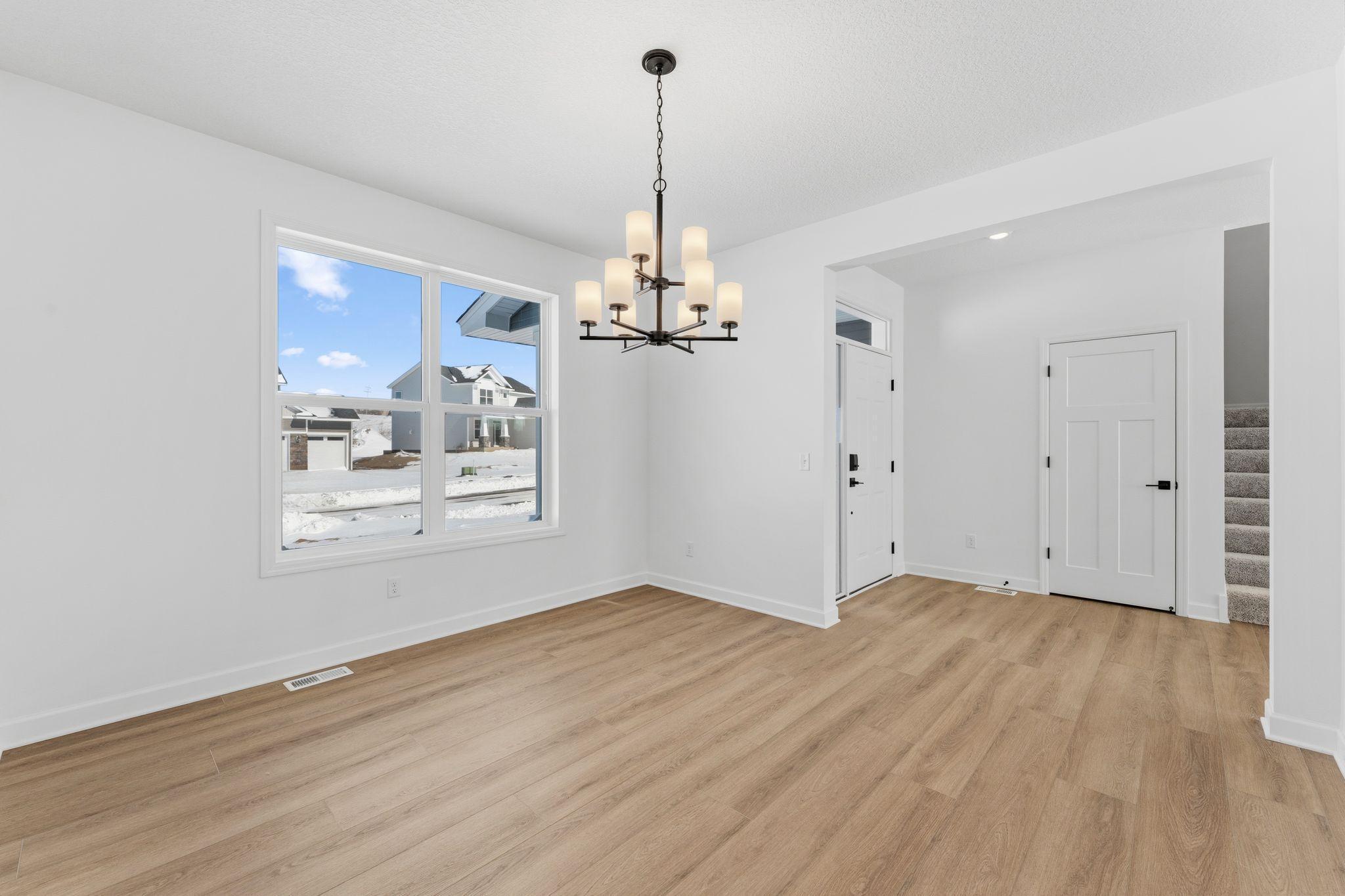 A formal dining room is easily accessed through the kitchen, ideal for dinners with extended family and holiday celebrations with guests.